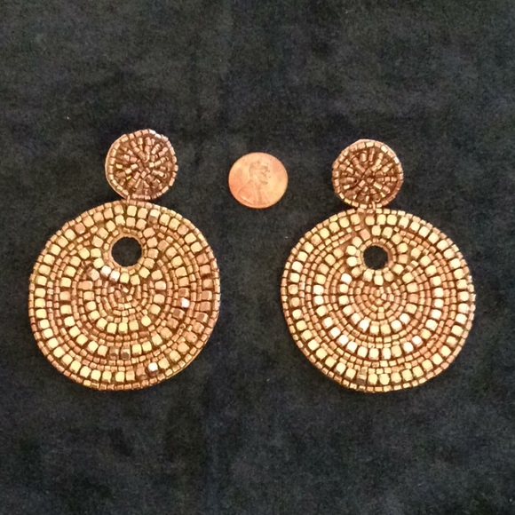 Hand Crafted Jewelry - Handmade beadwork attached to leather disc pierced